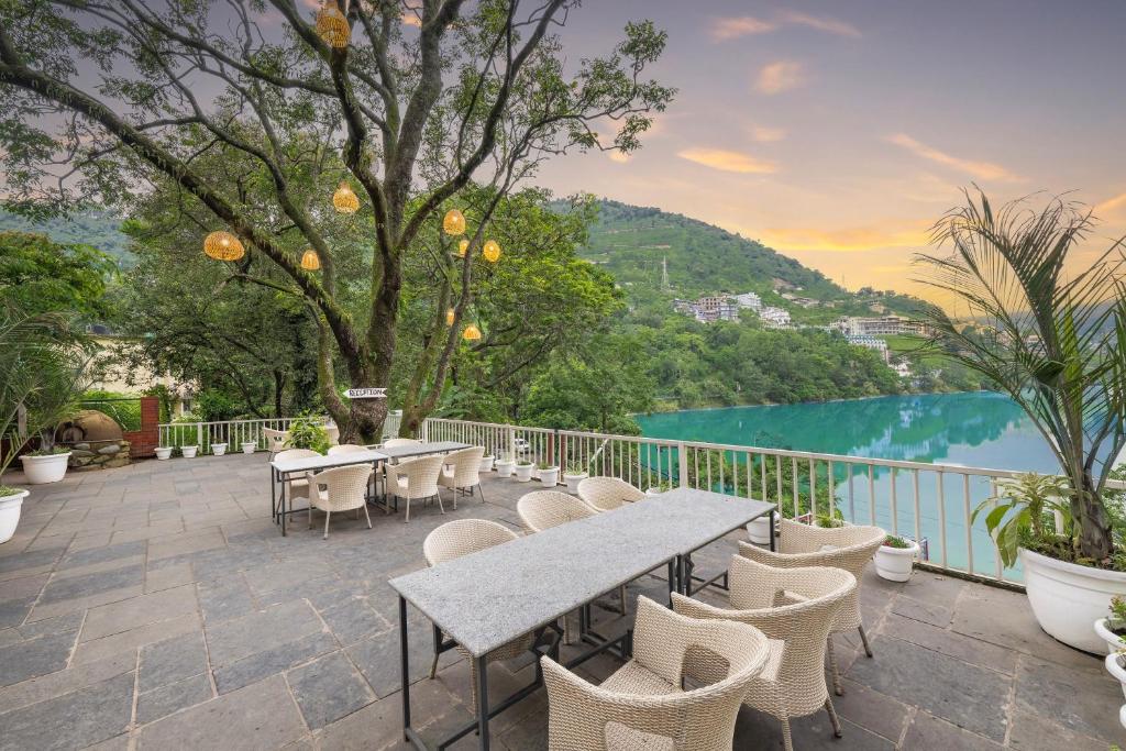 Lakeside resort terrace overlooking the water at sunset